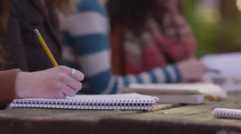 Closeup of college student taking notes Video stock 68979265