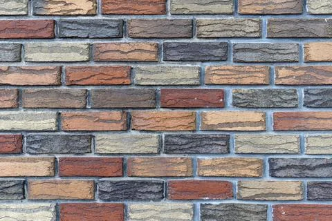Closeup of a colorful brick wall Stock Photos