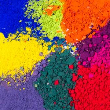 Closeup of colorful crushed makeup eyeshadow powder. Colorful background. Stock Photos