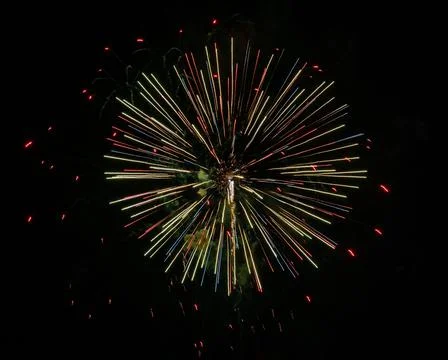 Closeup of colorful fireworks exploding in the dark sky Foto stock