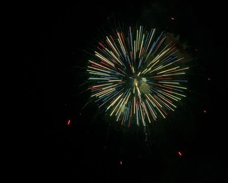 Closeup of colorful fireworks exploding in the dark sky 库存照片
