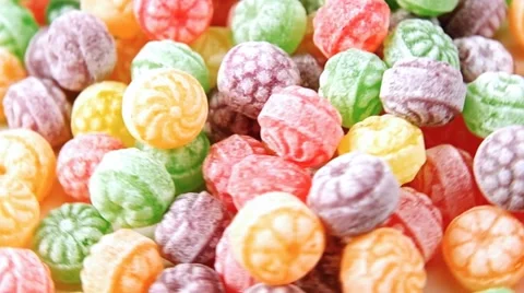 Closeup of colorful selection of hard candy rotating slowly Stock Footage 60963962
