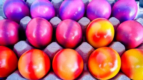 Closeup of colorfully decorated easter eggs in purple, pink, orange and red Stock Photos