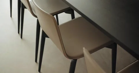 Closeup on comfortable empty chair near wooden dining table in modern kitchen Video stock 268835254