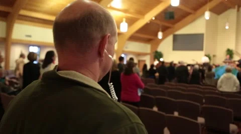 Closeup of Communication Headset on Church Security Officer Video stock 47751308