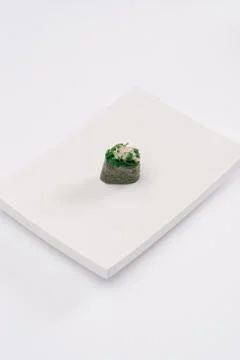 Closeup composition of one fresh salmon sashimi sushi with caviar on top on w Stock Photos