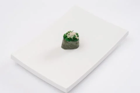 Closeup composition of one fresh salmon sashimi sushi with caviar on top on w Stock Photos