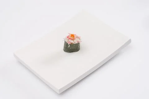 Closeup composition of one fresh salmon sashimi sushi with caviar on top on w Stock Photos