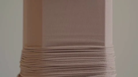 Closeup of compression stocking stretched on assist device for medical support Stock Footage 321709498