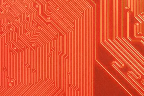 Closeup of computer circuit board in orange Stock Photos