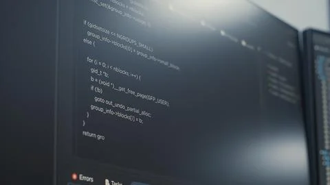 Closeup of computer display of software developer typing database functions.. Stock Photos