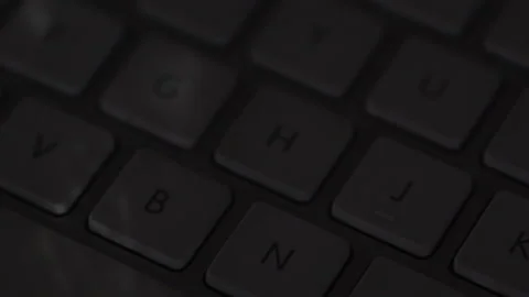 Closeup of computer keyboard with light shining from window Stock Footage 205035719
