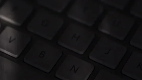 Closeup of computer keyboard with light shining from window Stock Footage 205242366
