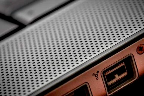 Closeup up of computer laptop selective focus on firewire port ideal for tech Stock Photos