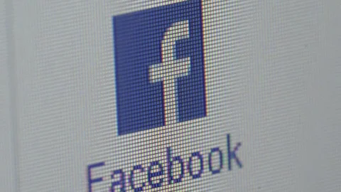 Closeup of computer screen with cursor pointing facebook address Stock Footage 98796899