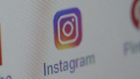 Closeup of computer screen with cursor pointing instagram addres Stock Footage 98797119