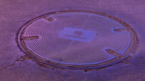 Closeup of Con Edison (Electrical Utility) Manhole Cover at Night Stock Footage 101308607