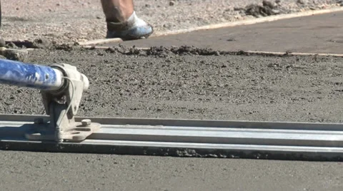 Closeup of concrete float smoothing freshly poured cement mix Stock Footage 39904972