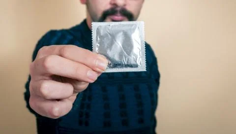 Closeup of the condom in the hand Foto stock