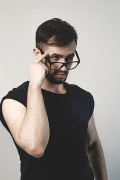 Closeup. confident modern man looking over his glasses Stock Photos