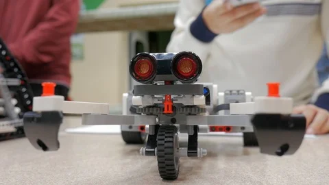 Closeup constructing modern robots first and programming their actions. Stock Footage 85552455