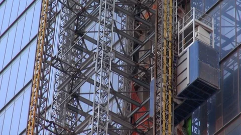 (Closeup) Construction Elevator Descending at Construction Site Stock Footage 104217074