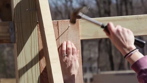 Closeup of Construction Worker Hammering in a Nail Stock Footage 81751202
