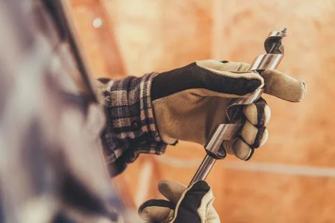 Closeup Of Construction Worker Holding Big Metal Drill Bit. Stock Photos