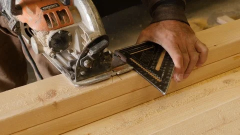 Closeup of Construction Worker Sawing Wood with Square Tool Stock Footage 104890163