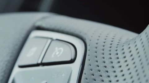Closeup of control button on car steering wheel. detail view Stock Footage 132755447
