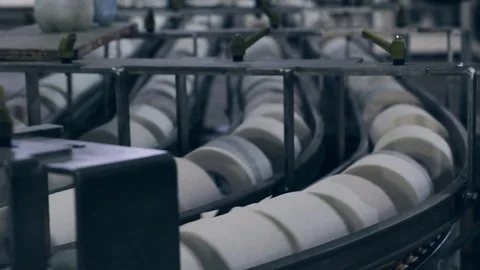 Closeup of conveyor and paper tissue rolls moving on it. Stock Footage 84051165