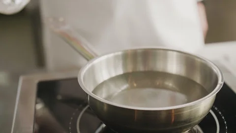 Closeup cook man pours vinegar into water Stock Footage 123129341