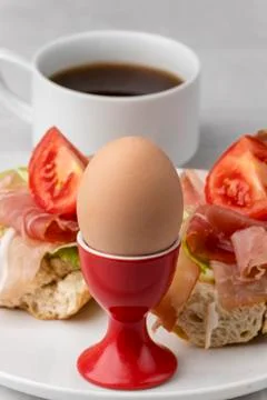 Closeup of a cooked egg with coffee Stock Photos