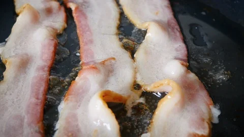 Closeup of Cooking Bacon Stock Footage 130158428