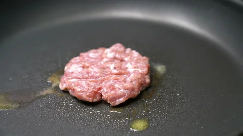 Closeup cooking pork burger in frying pan, Time Lapse Stock Footage 232562953