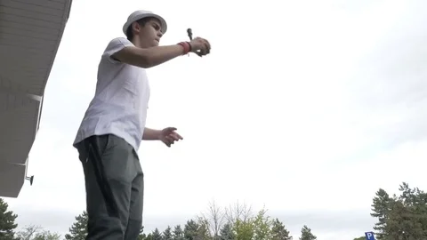 Closeup of cool kid in short white pants performing swirl stall and lighthous Stock Footage 81428696