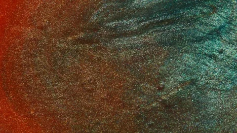 Closeup of copper shimmer fluid surface blending with teal tones in a flowing Stock Footage 311665234
