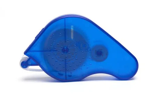 Closeup correction roller tape errors white background Close-up of a blue ... 写真素材