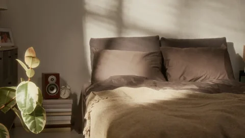 Closeup Cozy Bedroom with Dark Bedsheets Stock Footage 311499389