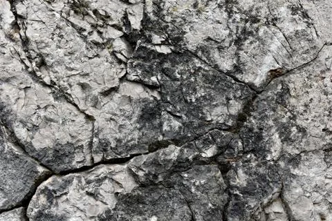 Closeup of a cracked limestone surface Stock Photos