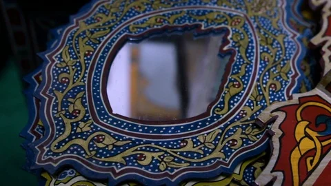 Closeup of a craft multicolor small mirror Stock Footage 123778272