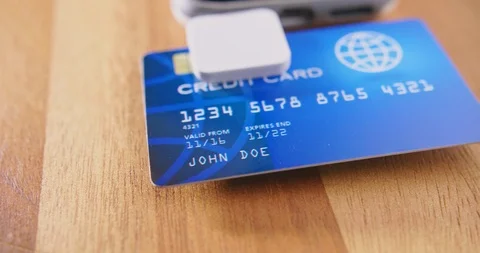 Closeup Of Credit Card Reader And Phone On Table Stock Footage 92365975