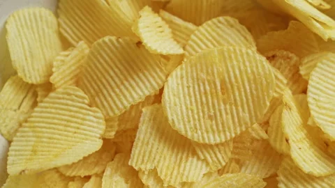 Closeup of crispy potato chips showcasing texture and color, perfect for sn.. Stock Footage 293843871