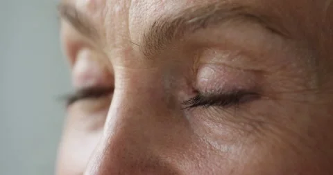 Closeup cropped view, upper part of face of older female Stock Footage 196543043