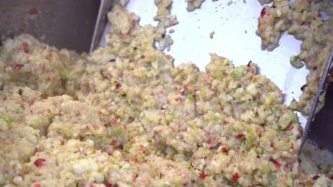 Closeup crushing in grinding box before squeezing in wooden press to produce Stock Footage 167564096