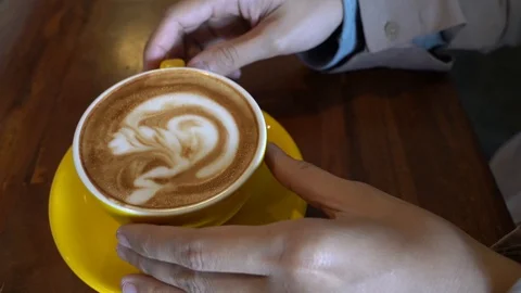 Closeup on a cup of coffe being put back at the saucer Stock Footage 113599571