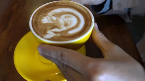 Closeup on a cup of coffe being put back at the saucer Stock Footage 113599580