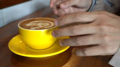 Closeup on a cup of coffe being took  Video stock 113599574