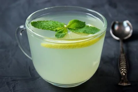 Closeup of Cup of Ginger tea with lemon and mint Stock Photos