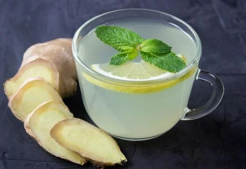 Closeup of Cup of Ginger tea with lemon and mint Stock Photos